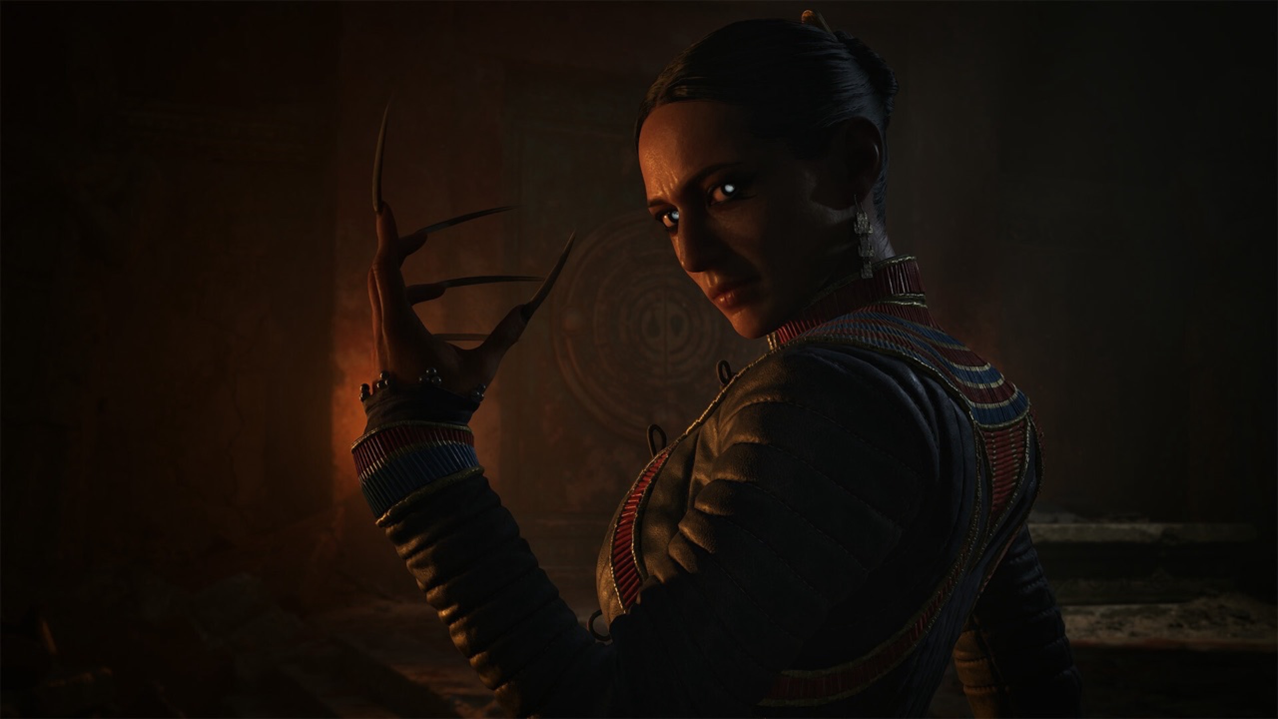 A female vampire showing her clawed hand.